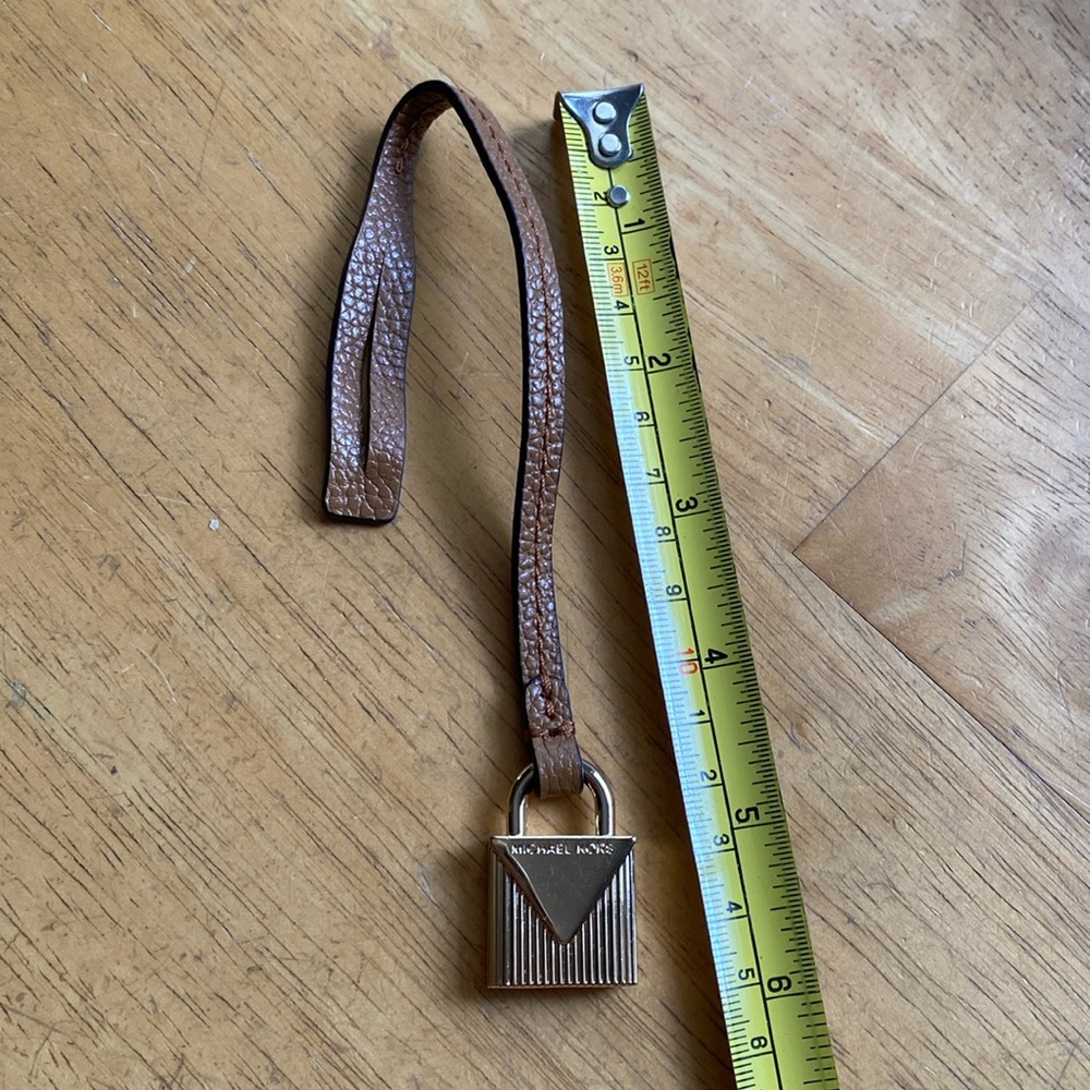Michael Kors gold metal, tan tone strap in great condition